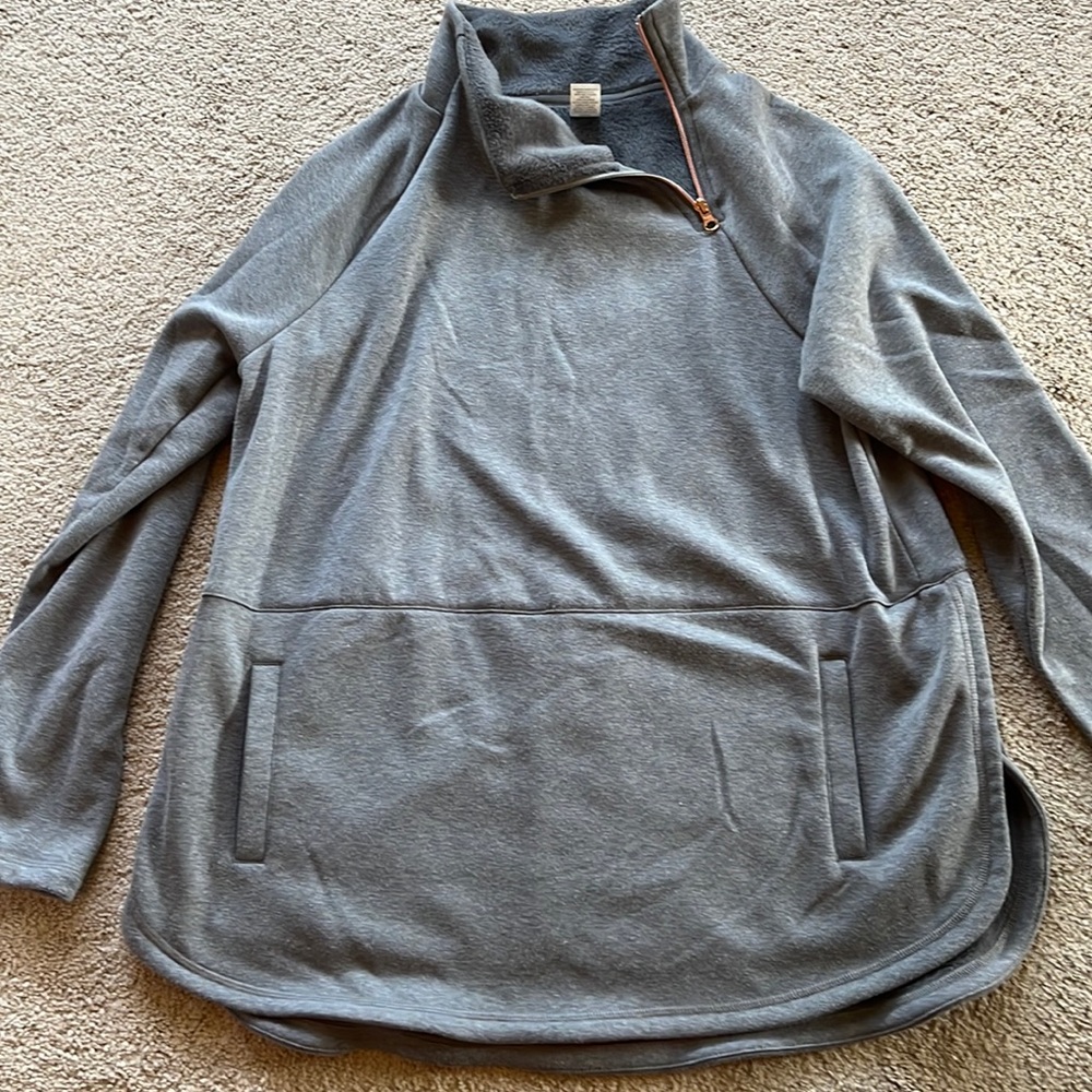 Gray sweatshirt from JCPENNEY. Worn 1x. Cute with leggings. Side split